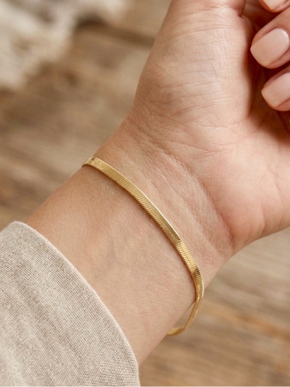 New in box. Gorgeous flat golden tone bracelet. (Flat snake type of chain).